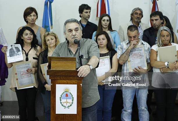 Secretary General of the CGT Juan Carlos Schmid speaks during the delivery of repaired files to the descendants of 20 disappeared railway workers at...