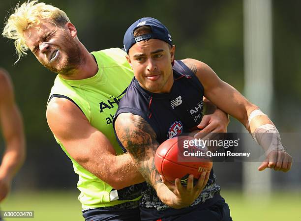 Ben Kennedy of the Demons is tackled by Jack Watts during a Melbourne Demons AFL training session at Gosch's Paddock on December 16, 2016 in...