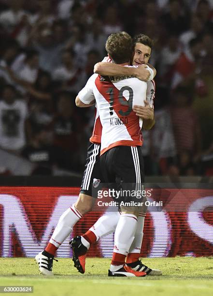 Lucas Alario of River Plate celebrates with teammate Ivan Alonso after scoring the third goal of his team during a final match between River Plate...