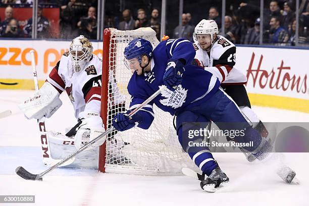 Toronto Maple Leafs center Zach Hyman attempts a wrap around with Oliver Ekman-Larsson chasing as the Toronto Maple Leafs lose to the Arizona Coyotes...