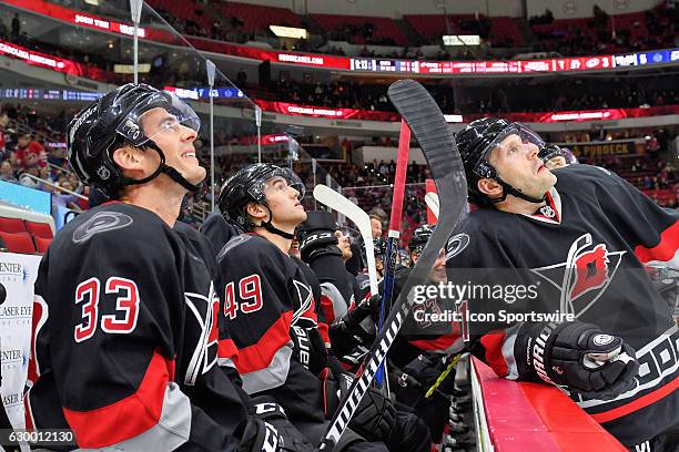 Carolina Hurricanes Right Wing Derek Ryan , Center Victor Rask and Right Wing Lee Stempniak watch a replay on the jumbotron in the third period of a...