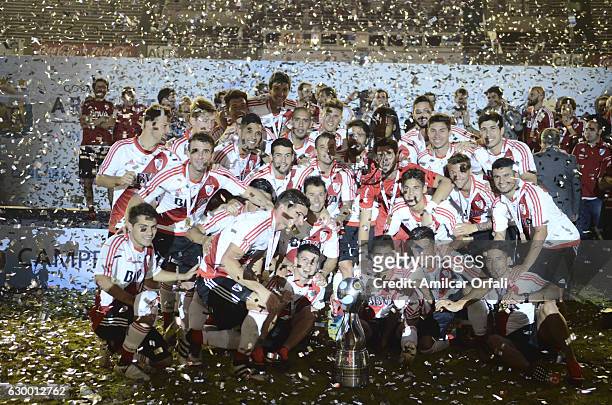 Players of River Plate pose for a team photo with the trophy after a final match between River Plate and Rosario Central as part of Copa Argentina...