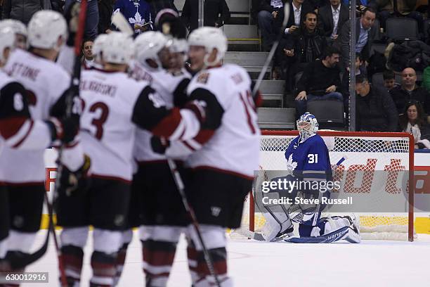 The Coyotes celebrate asbFormer Leaf Peter Holland blasts the shot through Frederik Andersen's legs for the winner as the Toronto Maple Leafs lose to...