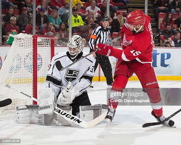 Jeff Zatkoff of the Los Angeles Kings makes a save on Riley Sheahan of the Detroit Red Wings during an NHL game at Joe Louis Arena on December 15,...