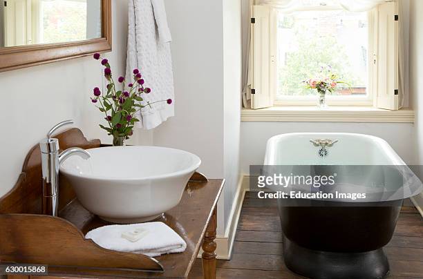 Bathroom with filled cast iron tub, Rachel Dowry's B&B, Baltimore, MD.