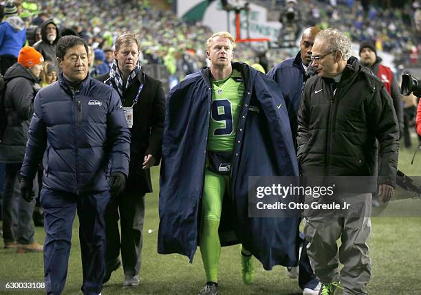 Punter Jon Ryan of the Seattle Seahawks leaves the game after getting injured on a play against the Los Angeles Rams at CenturyLink Field on December...