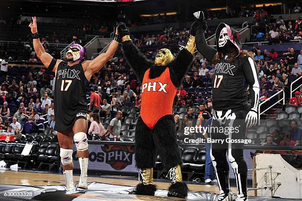 Wrestlers El Hijo Del Fantasma and La Parka attend Latin Night with the Phoenix Suns during the game against the San Antonio Spurs on December 15,...