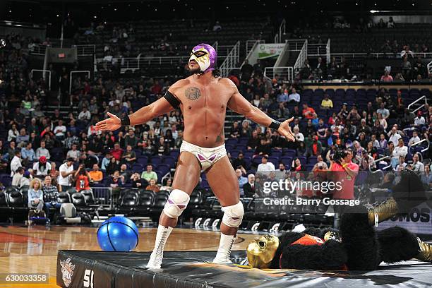 Wrestlers El Hijo Del Fantasma and La Parka attend Latin Night with the Phoenix Suns during the game against the San Antonio Spurs on December 15,...