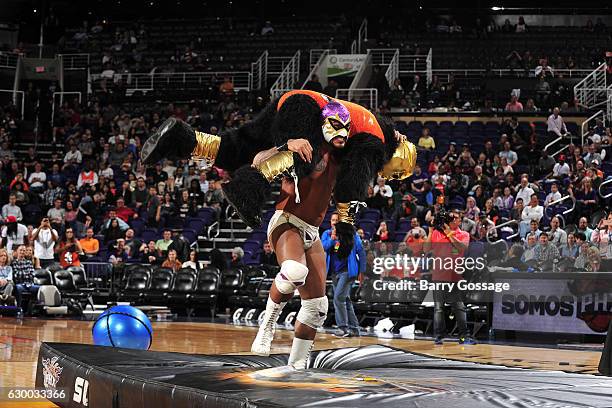 Wrestlers El Hijo Del Fantasma and La Parka attend Latin Night with the Phoenix Suns during the game against the San Antonio Spurs on December 15,...