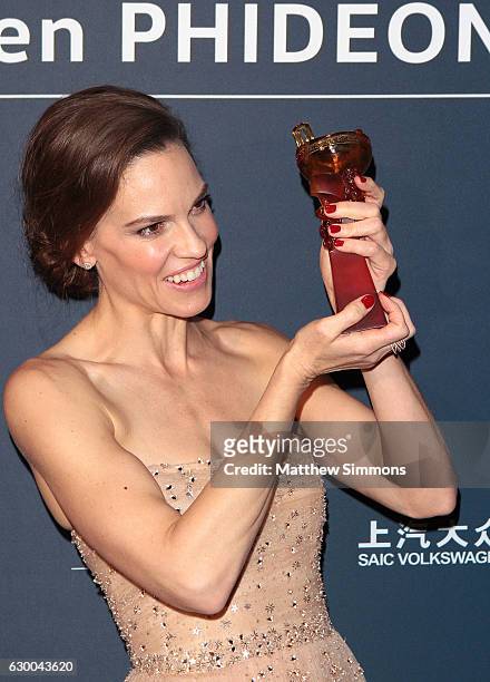 Actress Hilary Swank poses in the press room at the 21st Annual Huading Global Film Awards at The Theatre at Ace Hotel on December 15, 2016 in Los...