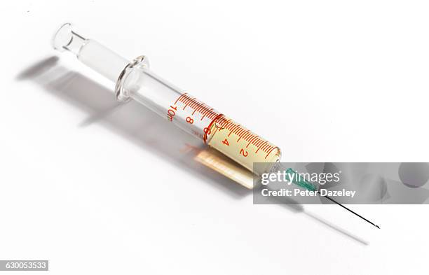 vaccination syringe - syringe stock-fotos und bilder