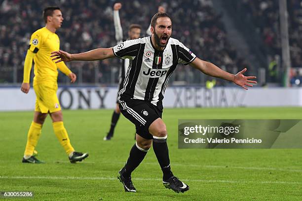 Gonzalo Higuain of Juventus celebrates after scoring the opening goal during the UEFA Champions League Group H match between Juventus and GNK Dinamo...