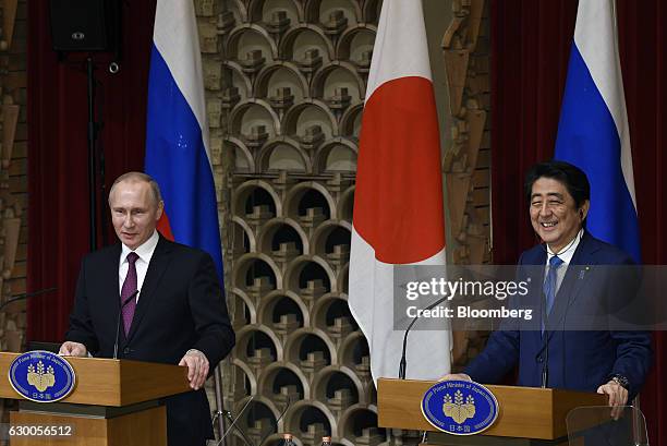 Vladimir Putin, Russia's president, left, and Shinzo Abe, Japan's prime minister, attend a news conference in Tokyo, Japan, on Friday, Dec. 16, 2016....