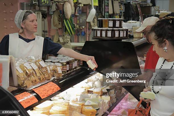 Amish woman selling cheese at the Reading Terminal Market.