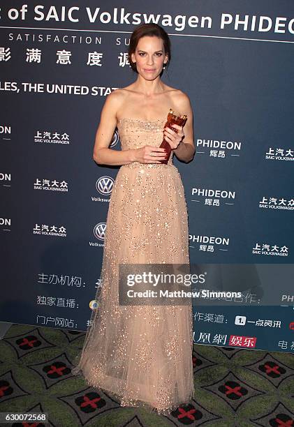 Actress Hilary Swank poses in the press room at the 21st Annual Huading Global Film Awards at The Theatre at Ace Hotel on December 15, 2016 in Los...