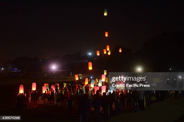 Pakistani civil society activists and Media foundation workers release lanterns in the sky as they pay tribute to victims of Army Public School...