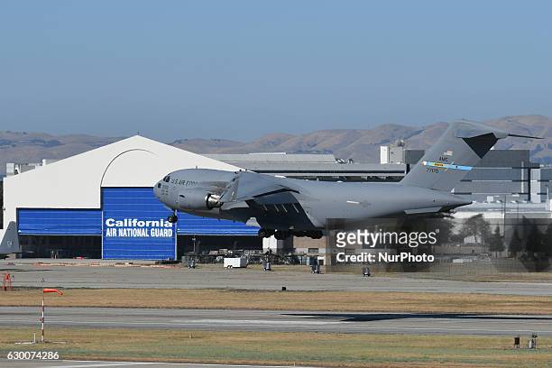 Air Force C-17 Globemaster III cargo plane of Dover Air Force Base carrying supporting equipment, including motorcade vehicle and helicopter, landed...