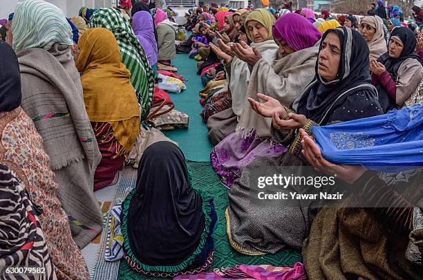 Kashmiri Muslim women offer prayers in the courtyard of the Hazratbal shrine on the Friday following Eid-e-Milad , or the birth anniversary of...