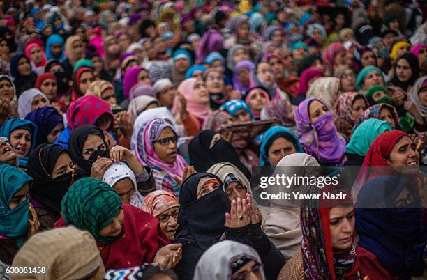 Kashmiri Muslim women pray, at Hazratbal shrine on the Friday following Eid-e-Milad , or the birth anniversary of Prophet Mohammad on December 16,...