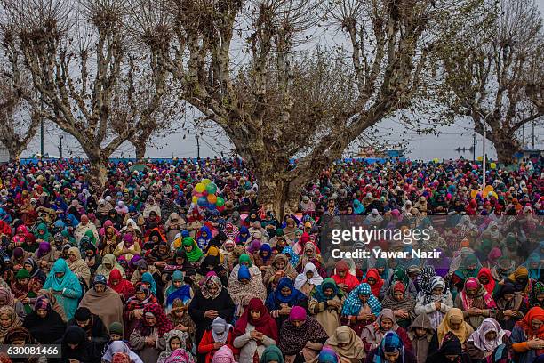 Kashmiri Muslim women pray, at Hazratbal shrine on the Friday following Eid-e-Milad , or the birth anniversary of Prophet Mohammad on December 16,...