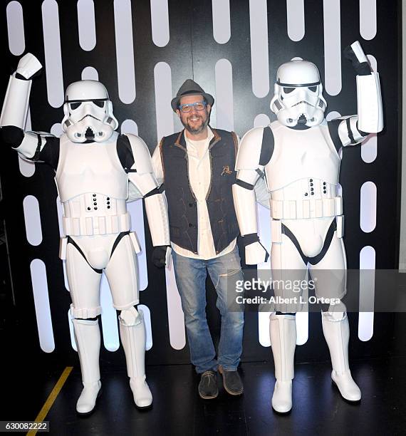 Composer Michael Giacchino poses with Storm Troopers at the Opening Night Celebration Of Walt Disney Pictures And Lucasfilm's "Rogue One: A Star Wars...