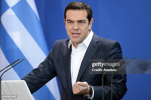 Greek Prime Minister Alexis Tsipras speaks during a joint press conference with German Chancellor Angela Merkel after their meeting in Berlin,...