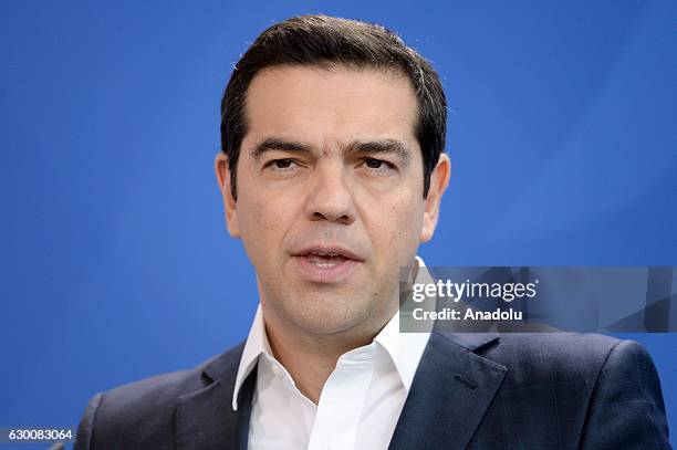 Greek Prime Minister Alexis Tsipras speaks during a joint press conference with German Chancellor Angela Merkel after their meeting in Berlin,...
