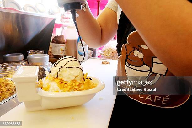 Served in a toilet, the Mango Bingsu includes milk shaved ice, corn flakes, mango, whipped cream, gelato, chocolate sauce and condensed milk. The...