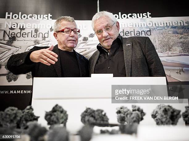 Polish-US architect and artist Daniel Libeskind speaks to the chairperson of the Dutch Auschwitz Committee Jacques Grishaver during the presentation...