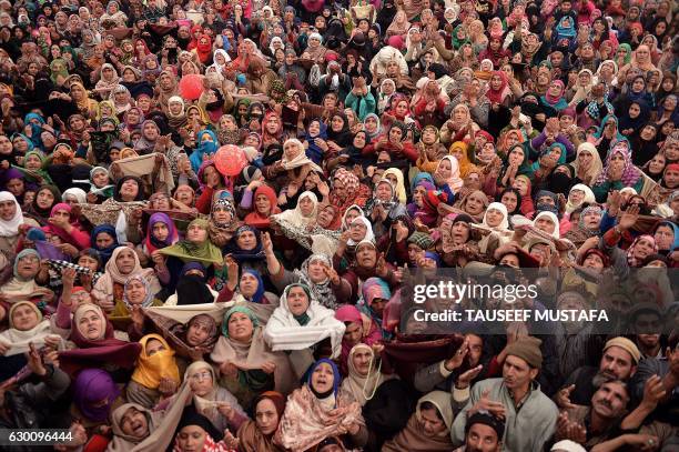 Kashmiri Muslims react as a custodian displays a relic believed to be a hair from the beard of Prophet Mohammed on the last Friday of celebrations...