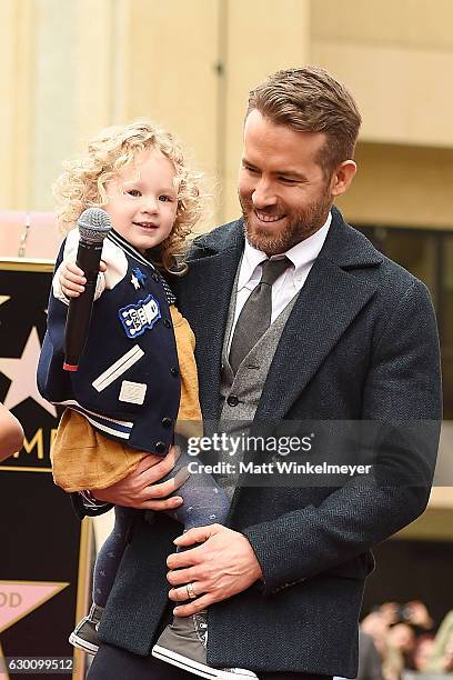 Actor Ryan Reynolds poses for a photo with his daughter, James Reynolds during a ceremony honoring him with a star on the Hollywood Walk of Fame on...