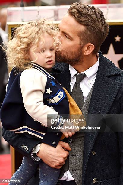 Actor Ryan Reynolds poses for a photo with his daughter, James Reynolds during a ceremony honoring him with a star on the Hollywood Walk of Fame on...
