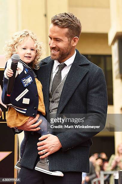 Actor Ryan Reynolds poses for a photo with his daughter, James Reynolds during a ceremony honoring him with a star on the Hollywood Walk of Fame on...