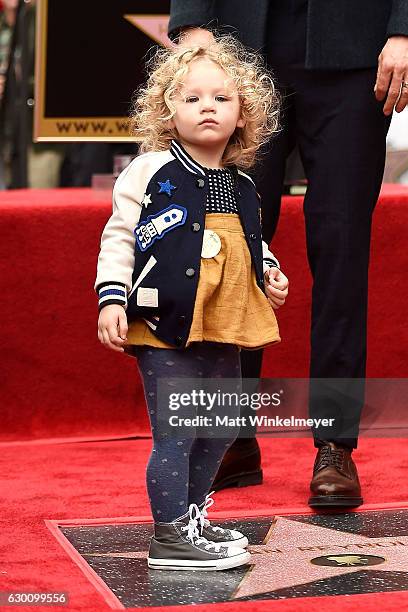 Actor Ryan Reynolds poses for a photo with his daughter, James Reynolds during a ceremony honoring him with a star on the Hollywood Walk of Fame on...