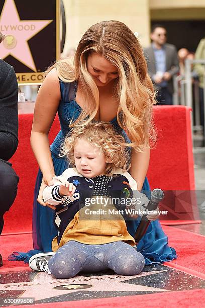 Actress Blake Lively poses for a photo with her daughter, James Reynolds during a ceremony honoring Ryan Reynolds with a star on the Hollywood Walk...