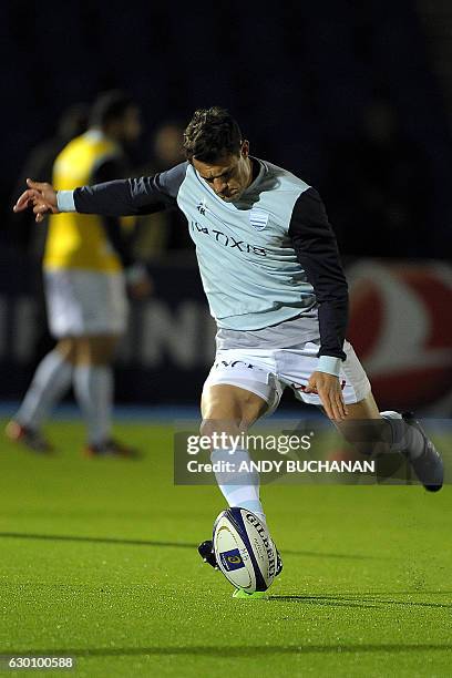 Racing 92's New Zealand fly-half Dan Carter practices his kicking ahead of the European Champions Cup pool 1 rugby union match between Glasgow...