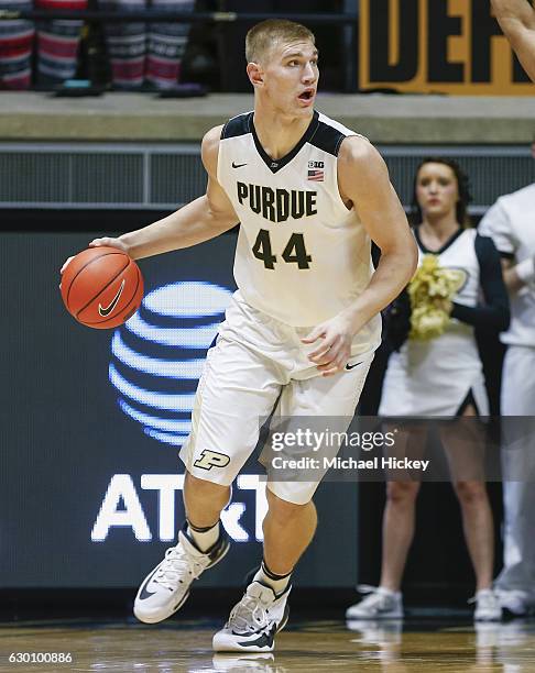 Isaac Haas of the Purdue Boilermakers dribbles the ball against the Cleveland State Vikings at Mackey Arena on December 10, 2016 in West Lafayette,...