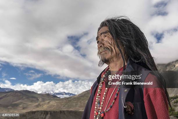 Portrait of a Sadhu, holy man, looking into the himalayan mountains.