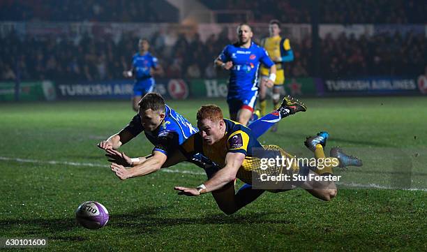 Warriors player Connor Braid dives to score the opening try during the European Rugby Challenge Cup match between Newport Gwent Dragons and Worcester...