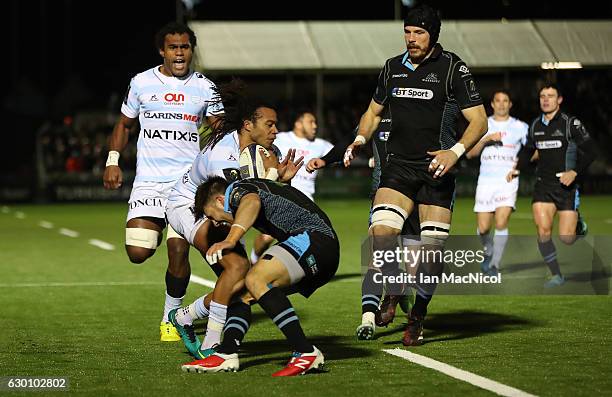 Teddy Thomas of Racing 92 is tackled by Ali Price of Glasgow during the European Rugby Champions Cup match between Glasgow Warriors and Racing 92 at...