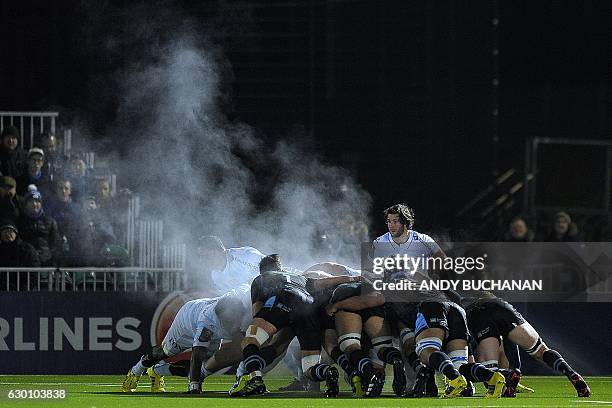 Steam rises above the packs during a scrum during the European Champions Cup pool 1 rugby union match between Glasgow Warriors and Racing 92 at...