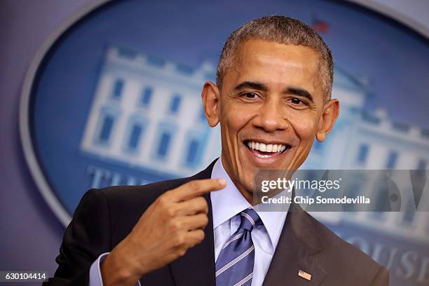 President Barack Obama smiles as he answers questions during a news conference in the Brady Press Breifing Room at the White House December 16, 2016...