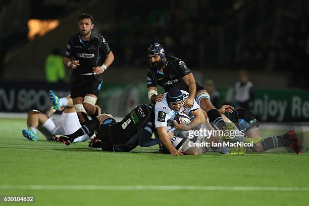 Francois van der Merwe of Racing 92 is tackled by Josh Strauss of Glasgow during the European Rugby Champions Cup match between Glasgow Warriors and...