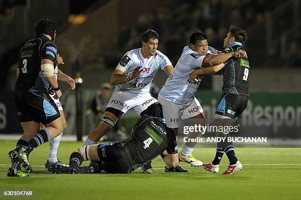 Racing 92's Samoan prop Viliamu Afatia is stopped by Glasgow Warriors' Scottish scrum-half Ali Price during the European Champions Cup pool 1 rugby...