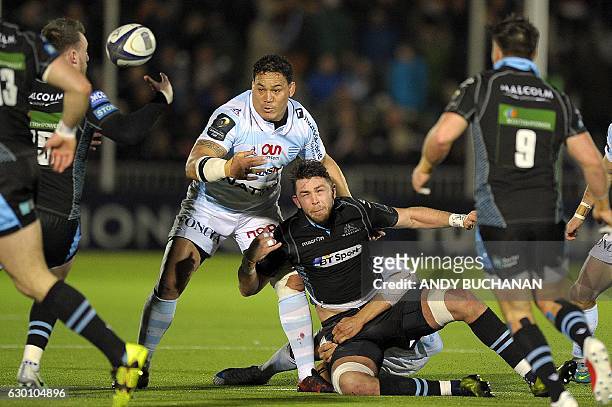 Glasgow Warriors' Scottish flanker Ryan Wilson is tackled during the European Champions Cup pool 1 rugby union match between Glasgow Warriors and...