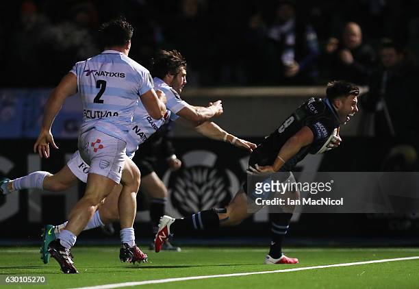 Ali Price of Glasgow scores the third try of the game during the European Rugby Champions Cup match between Glasgow Warriors and Racing 92 at...