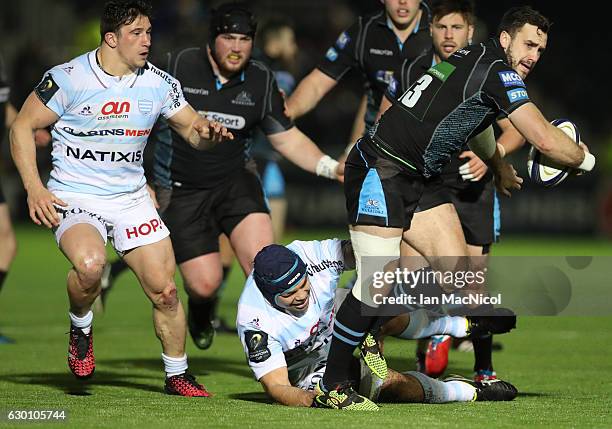 Alex Dunbar of Glasgow is tackled by Francois van der Merwe of Racing 92 during the European Rugby Champions Cup match between Glasgow Warriors and...