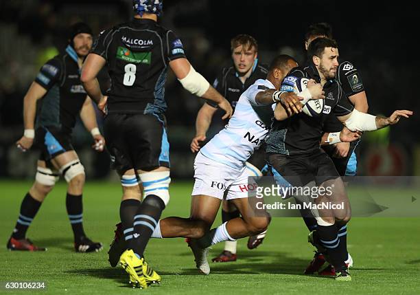 Alex Dunbar of Glasgow is tackled by Joe Rokocoko of Racing 92 during the European Rugby Champions Cup match between Glasgow Warriors and Racing 92...