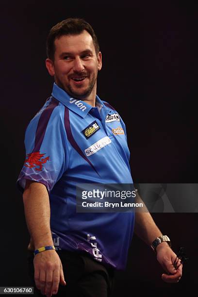 Jonny Clayton of Great Britain reacts to beating Gerwyn Price of Great Britain during their first round match on day two of the 2017 William Hill PDC...