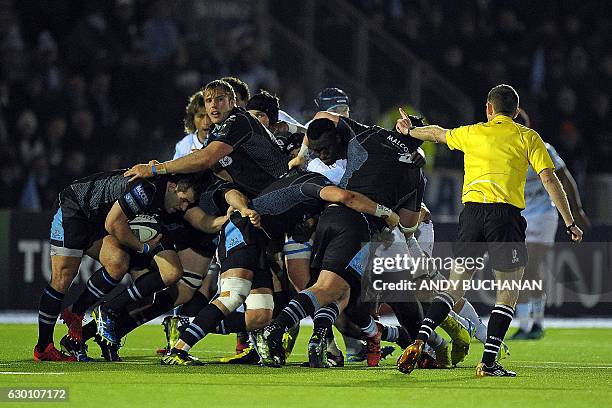 Glasgow players move the ball in a maul during the European Champions Cup pool 1 rugby union match between Glasgow Warriors and Racing 92 at...